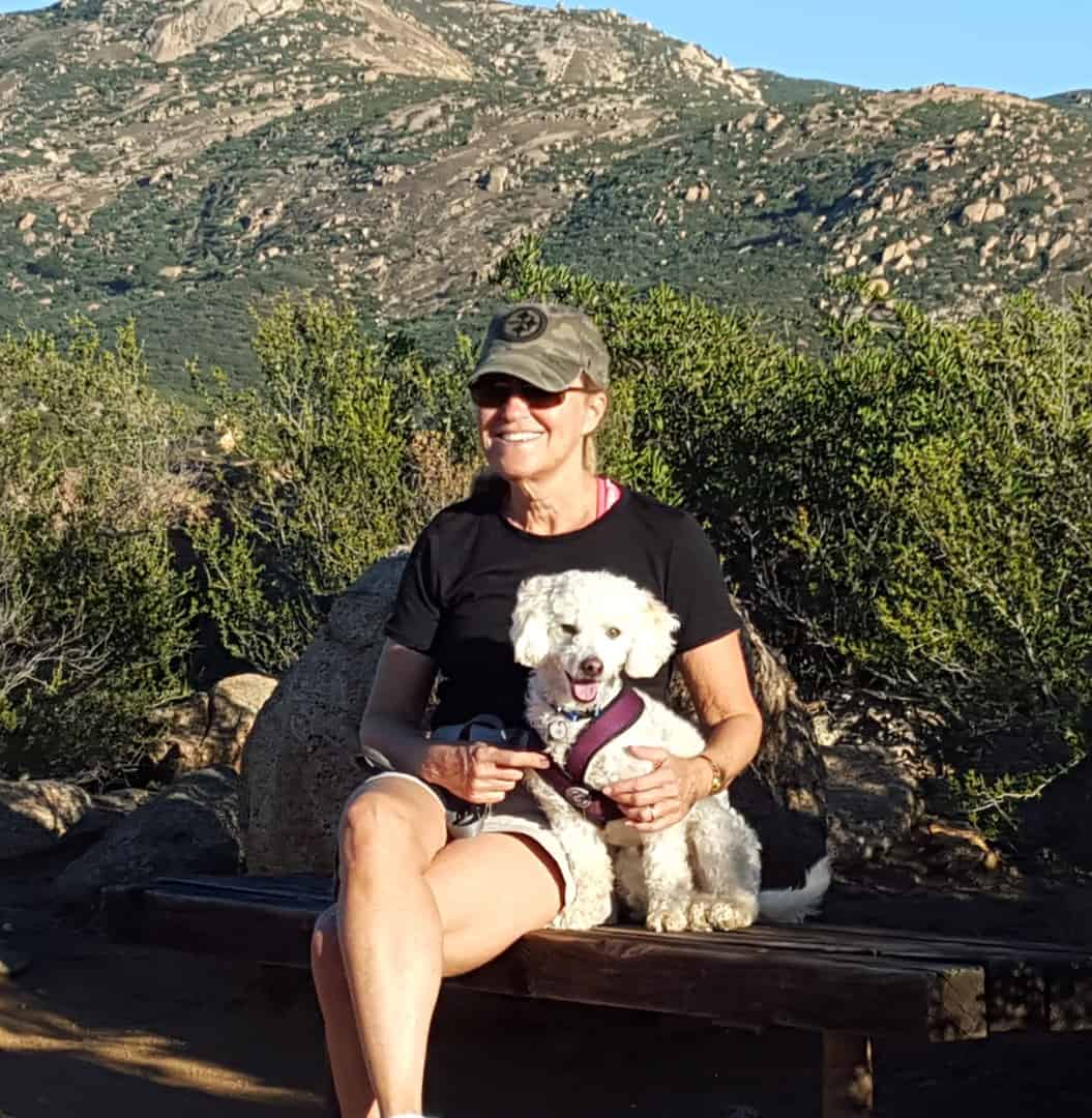 Debbie hiking with her dog, Auggie